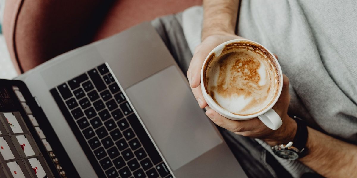 Coffee, cup, computer — Massage Nuru London Experiences Focused on Sensual Relaxation, Intimate Connection, and Therapeutic T